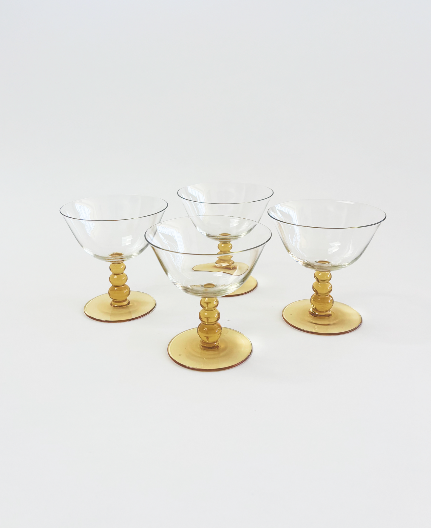 SET OF 4 YELLOW STEMMED COUPES